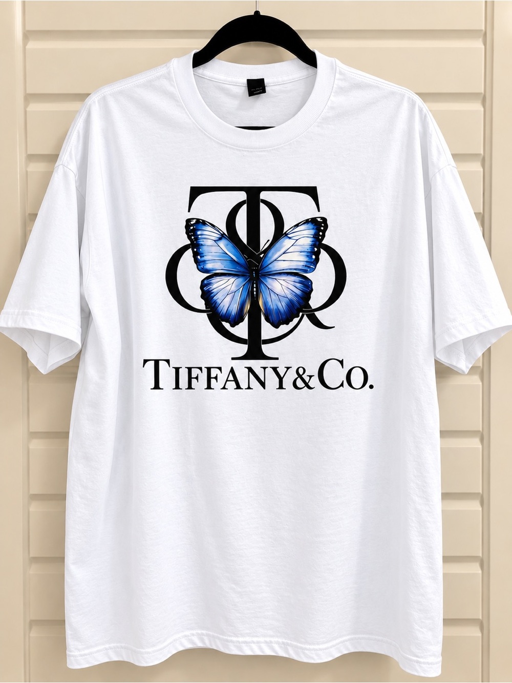 White Short-Sleeve Tee with Blue Butterfly Logo